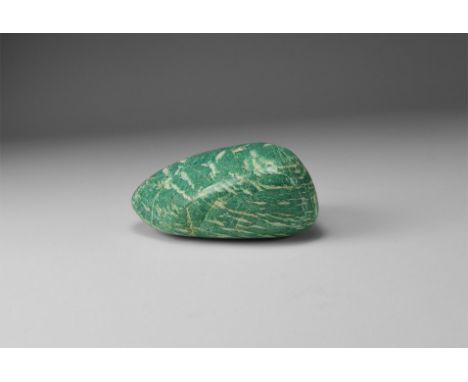 A large, polished 'tumblestone' pebble of amazonite with pale green colour and flecks of white. 189 grams, 81mm (3 1/4"). Fro