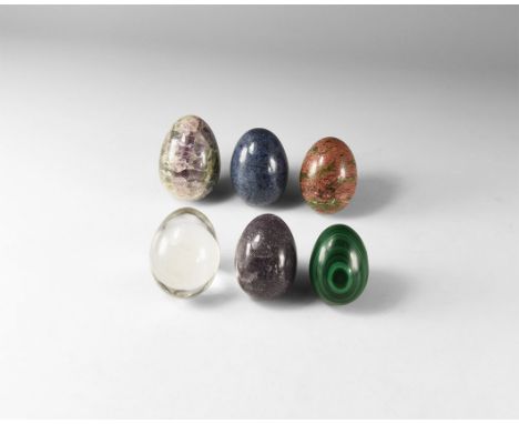 A group of six polished gemstone eggs including: malachite, quartz crystal, fluorite, unakite, sodalite and amethyst. 977 gra