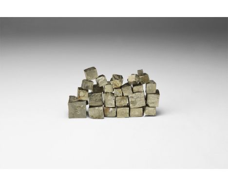 A group of twenty-five polished pyrite cubes. 105 grams total, 4-14mm (1/4 - 1/2"). From the historic ‘Victorian Museum’ and 