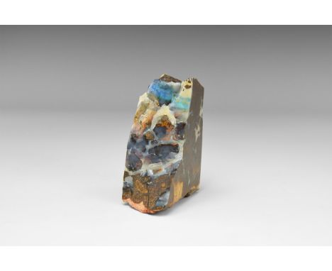 A fine example of precious opal in a sawn sandstone block with polished sides, opal to both edges showing good 'fire' with bl