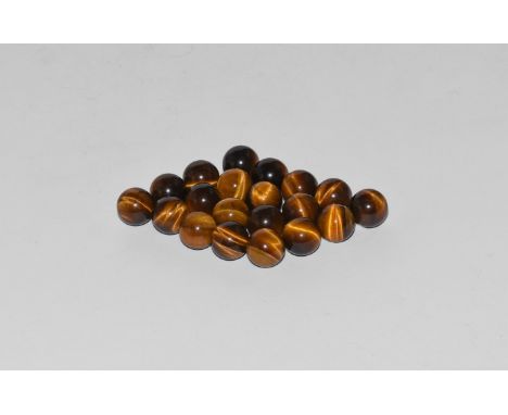 A group of twenty tigers eye spheres showing bands of black and brown silky lustre. 15 grams total, 8mm (1/4"). From the hist