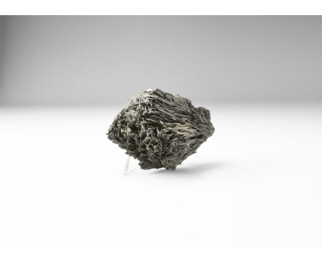 A specimen of shiny grey zinkenite formed as thin needles concentrated to the centre. 179 grams, 81mm (3 1/4"). From the hist