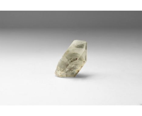 A fine crystal of transparent quartz with dark green phantoms, in white card tray with label reading: 'PHANTOM QUARTZ, Minas 