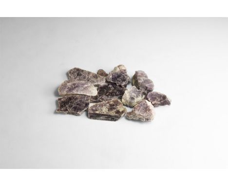 A group of ten pale purple lepidolite pieces with 'mother of pearl' reflection. 256 grams total, 33-59mm (1 1/4 - 2 1/4"). Fr