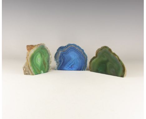 A group of cut and polished banded agate geodes, two green and one blue, colour enhanced. 1.63 kg total, 10.6-12.2cm (4 - 4 3