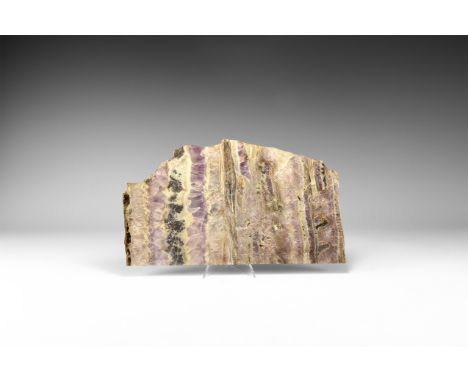 A large cut banded amethyst slice, approximately 3mm thick, with violet, white and grey colour. 334 grams, 25cm (10"). From t