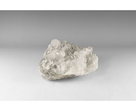 A large specimen of transparent quartz crystals on a quartz matrix. 4.53 kg, 19cm (7 1/2"). From the historic ‘Victorian Muse