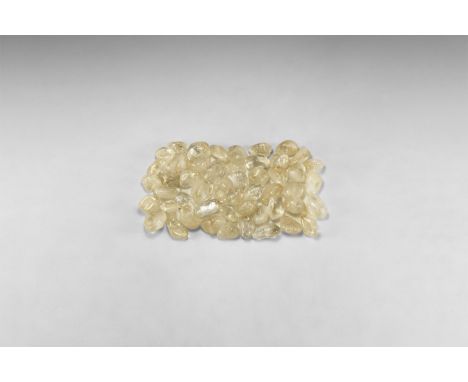 A group of fifty polished pale yellow citrine specimens. 666 grams total, 24-37mm (1 - 1 1/2"). From the historic ‘Victorian 