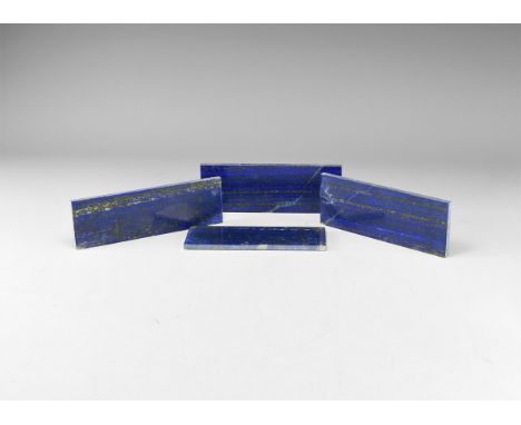 A group of four gem-quality rectangular lapis lazuli plaques, approximately 5mm thick, polished on one side. 411 grams total,