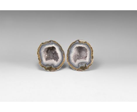 A pair of cut and polished geode with bands of blue agate and lilac amethyst crystals to the centre. 1.09 kg total, 10.6cm (4