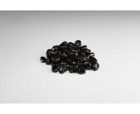 A group of fifty polished black obsidian pieces, sometimes called 'Apache Tears'. 442 grams total, 16-25mm (3/4 -1"). From th