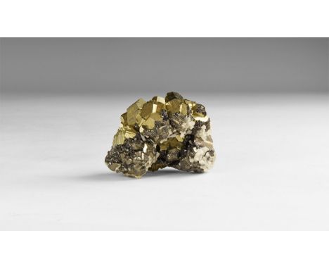 A fine specimen of bournonite with cubes of pyrite, in white card tray with label reading: 'BOURNONITE with pyrite, Quiruvilc