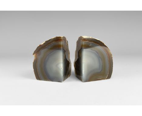 A pair of cut and polished blue and brown agate bookends. 1.64 kg total, 10.6cm (4 1/4"). From the historic ‘Victorian Museum