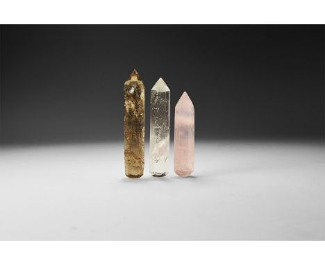 A group of three finely cut smoky quartz, rose quartz and rock crystal obelisk or massage tools. 75 grams total, 63-80mm (2 1