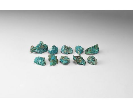 A group of ten bright cyan-coloured chrysocolla pieces. 75 grams total, 20-42mm (3/4 - 1 3/4"). From the historic ‘Victorian 