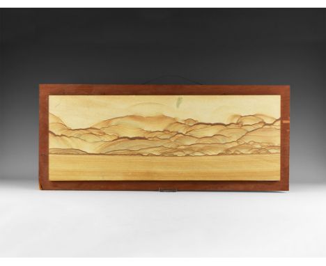 A large slab of framed Utah 'picture sandstone' with the layers picked out in iron oxide minerals displaying the characterist