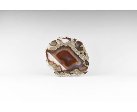 A thick cut and polished agate slice with dark brown and blue bands. 662 grams, 18cm (7"). From the historic ‘Victorian Museu