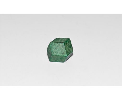 A pseudomorph of malachite replacing a dodecahedral crystal of cuprite, in white card box with label reading: 'MALACHITE afte