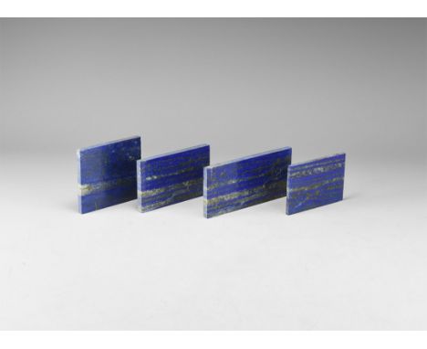 A group of four gem-quality, rectangular lapis lazuli plaques, approximately 3-6mm thick, polished on one side. 304 grams tot