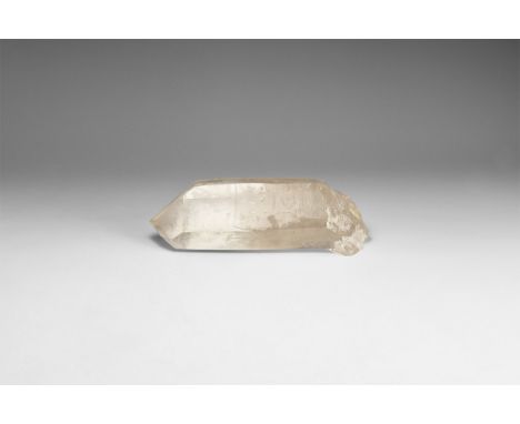 A large hexagonal crystal of transparent quartz. 500 grams, 15.5cm (6"). From the historic ‘Victorian Museum’ and later colle