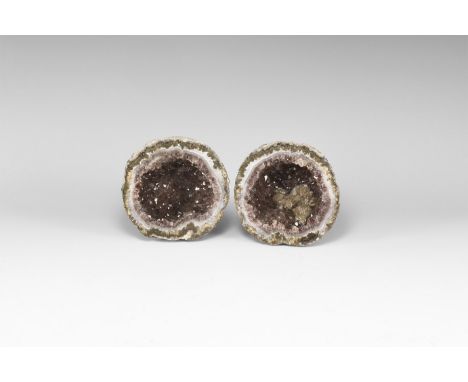 A pair of cut and polished geode with bands of blue agate enclosing purple amethyst crystals to the centre, with accessory br
