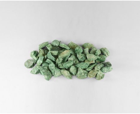 A group of twenty fuschite mica chunks with a waxy green lustre. See Bonewitz, Dr. Ronald Louis, Rocks & Minerals, 2008, p.26