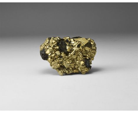 A fine pyrite specimen with well-formed crystals exhibiting a combination of cubic and octahedral faces, in old white card tr