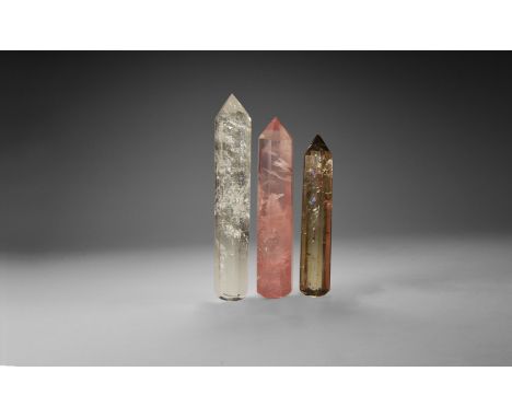 A group of three finely cut smoky quartz, rose quartz and rock crystal obelisks or massage tools. 129 grams total, 7.9-10cm (