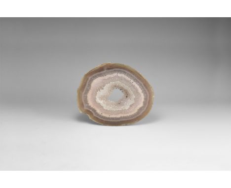 A thick cut and polished slice with banded agate and honeycomb crystals, central void framed with miniature crystals. 482 gra