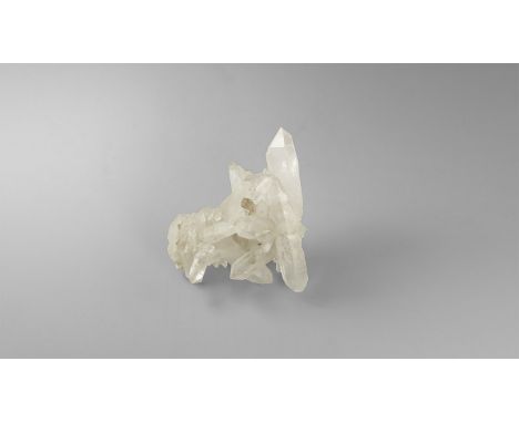 An unusually fine cluster of quartz crystals with several large prismatic crystals interlocking across, in white card tray wi