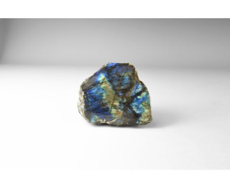 A polished labradorite boulder with rich colour play on front face, principally blue and gold. 561 grams, 89mm (3 1/4"). From