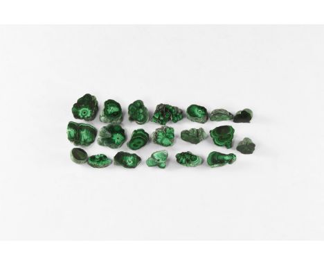 A group of twenty cut and polished malachite stalactite sections with bands of dark and pale green colour.  100 grams total, 