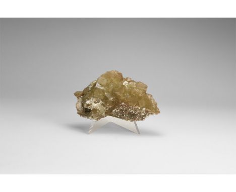 A fine specimen of dark yellow cubic crystals of fluorite on a matrix, in white card tray with car reading: 'FLUORITE, Muscon