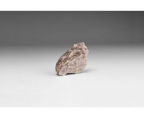 A fine specimen of pale purple lepidolite, in white card box with label reading: 'LEPIDOLITE MICA, Brazil'. 26 grams, 43mm (1