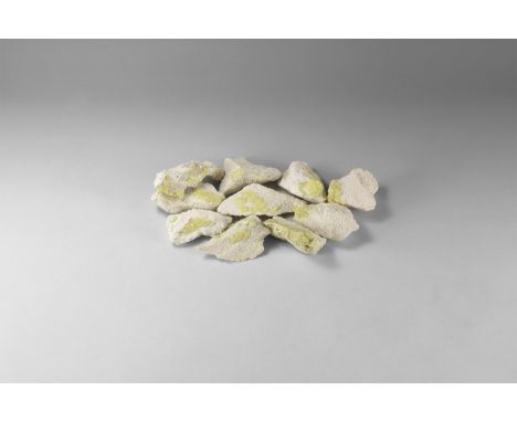 A group of ten sulphur specimens on white matrix, from Bolivia. 242 grams total, 52-75mm (2 - 3"). From the historic ‘Victori