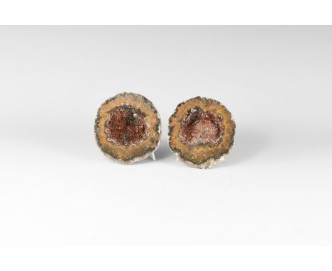 A pair of cut and polished geode with bands of orange and brown agate, red phantom quartz crystals to the interior. 514 grams