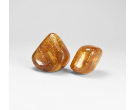 A pair of cut and polished citrine calcite specimens with 'rainbow' reflections to the surface. 135 grams total, 33-45mm (1 1