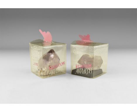 A pair of amethyst crystals with well formed facets and a pale purple colour darkening at the tips and with rainbow reflectio