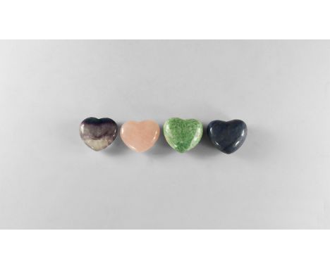 A group of four carved and polished hearts of amazonite, rose quartz, fluorite and blue quartz. 244 grams total, 45mm (1 3/4"