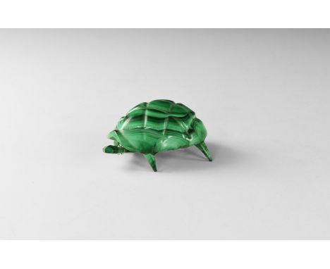 A figure of a turtle with glued legs and head attached on a wire to the underside; all pieces carved from green banded malach