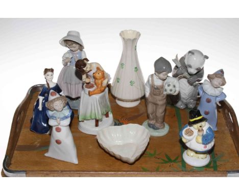 Belleek vase and heart shaped dish, five Nao figures, two Royal Doulton figures and Coalport 'Paddington bakes a cake'.