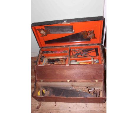 Carpenters tool box and carpentry tools and box of hand saws.