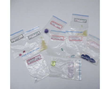 Collection of cut unmounted gemstones including cabochon rubies, Lapiz Lazuli, water opal etc. 