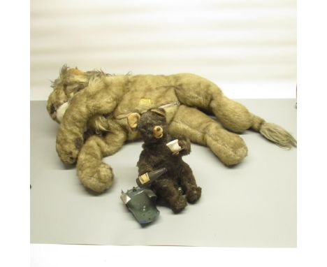 Mid C20th battery operated bear drinking Pepsi Cola, sitting on a tin plate log (A/F) and a modern Merrythought lion, L48cm 