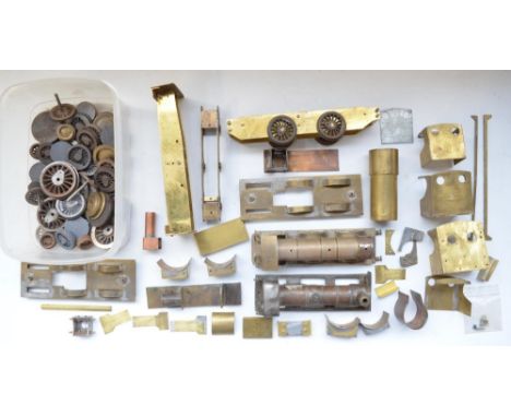 Collection of mostly home built O gauge live steam model train parts in brass and metal including cast steel wheels, cab sect