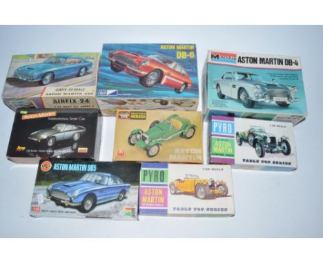 Eight Aston Martin plastic model kits of various scales including unbuilt DB4, Airfix DB6, Airfix 1:24 scale Red Stripe DB6, 