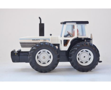 Boxed Britain's Powerfarm motorised 1/32 County 1884 Tractor in white (item 9324) and Mashio Powered Harrow (item 9343), both