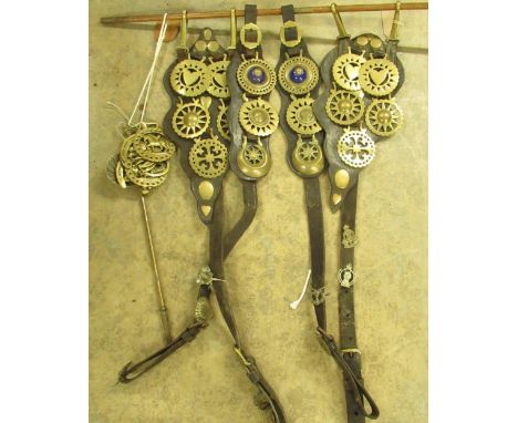 Collection of twenty three horse brasses incl. heart, star, crescent, etc. on four leather straps with Ordnance, Armoured Cor