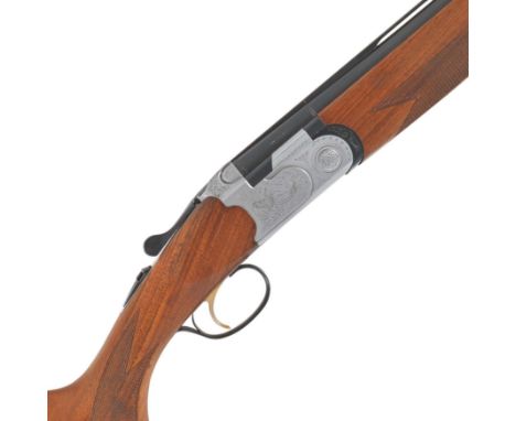 A 20-bore 'Mod. S687' single-trigger over-and-under ejector gun by Beretta, no. E31982BHold-open toplever, foliate-scroll eng