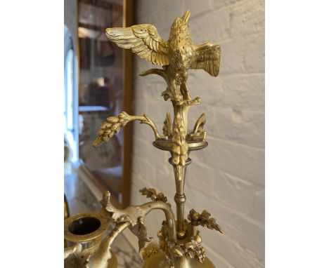 A pair of Louis XVI ormolu three-light candelabraEach modelled with a maiden holding scrolling branches in each hand and a fu